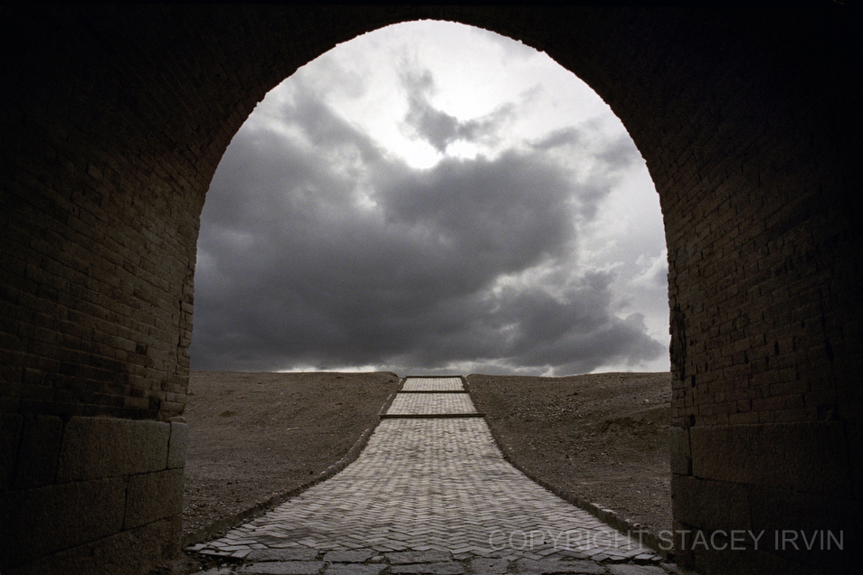 The rear gate of Jiayuguan Fort at the end the Great Wall.  Chinese exiles, soldiers, and trading caravans would pass through these gates heading westward, into the the Gobi Desert and through the territory surrounding the Taklamakan Desert.  Historically, the Chinese have thought of the traditional inhabitants of this region as “barbarians”.